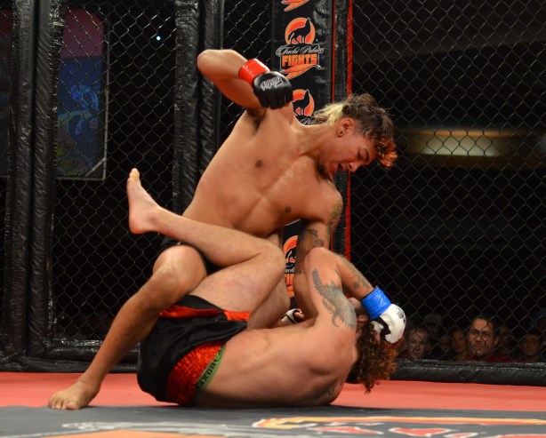 Andre Fili posturing up for a big right hand, as Enoch Wilson defends in guard!
