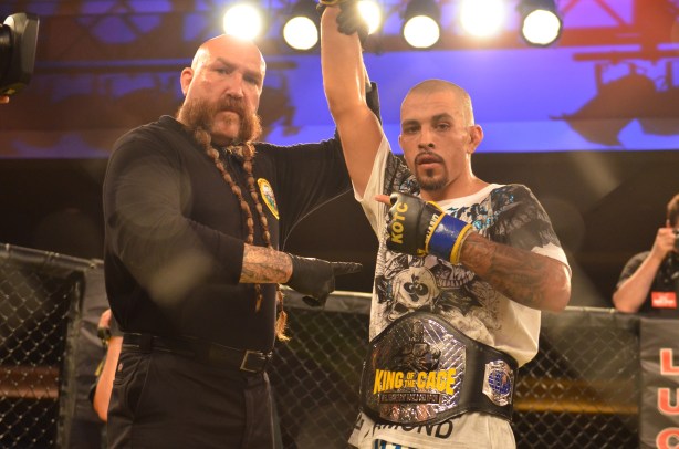 Joshua 'El Rey' Aveles is awarded the victory! with Mike Beltran.