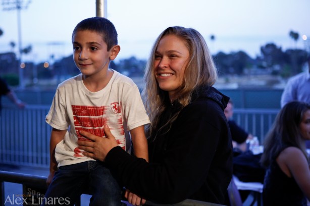 UFC Champion Ronda Rousey poses with a young fan! #ChaosAtTheCasino